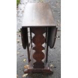 Oak drop leaf table. 73 x 33 x 50cms. 122cms open.