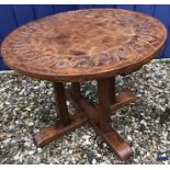 Gnomeman oak circular coffee table with carved top. 46cms h x 60cms w.