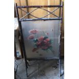 A 19thC bamboo firescreen with floral painting.