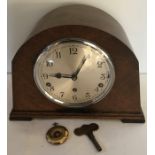Oak cased mantle clock with Westminster chime Garrard movement. 22cms
