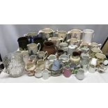 A large collection of ceramic jugs with 2 mugs and 1 glass jug.