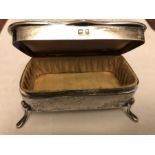 A silver silk lined jewellery box, Birmingham 1912. 73.2gms.