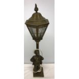 Brass lamp with whistling boy, 67cms h.