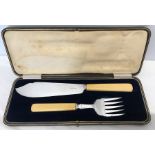 A cased hallmarked silver fish serving set ivorine handles. A and D Sheffield 1925.
