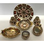 Seven pieces of Royal Crown Derby, hairline crack to largest dish. 6.5cms d.