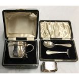 Boxed silver christening mug, boxed silver 113gms approx spoon & pusher and silver napkin ring.