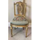 Carved 19thC giltwood chair with wool work upholstery to seat.