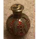 Decorative gilt metal bound, red glass scent bottle. 6cms h.