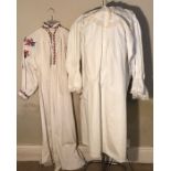 Two cotton nightgowns, early 20thC, one with lace and ribbon.