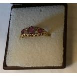 An 18ct gold pink stone and diamond ring. Size N. 3.2gms.