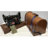 Oak cased singer electric sewing machine in case.