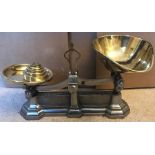 W&T Avery cast iron scales with brass pans and weights.