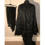 Black Edwardian skirt with label, 'The Flawless Reg' with Victorian black silk cape with buttons and