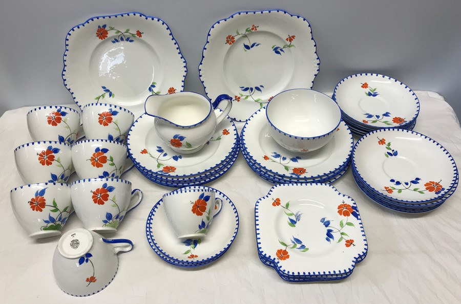 Grafton china part tea set, floral painted with blue rim. 42 pieces.