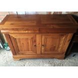 A French sideboard in fruitwood with 2 drawers over 2 cupboards.