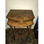 Two walnut nesting tables.