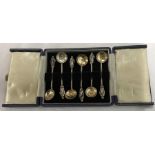 A cased set of 6 apostle silver gilt salt spoons, Roberts and Beck, Sheffield 1865. 64gms.