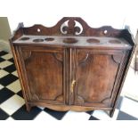 Mahogany wall hanging cupboard. 59 h x 57cms w x 16.5cms d. 2 interior shelves, 1 plywood. Condition