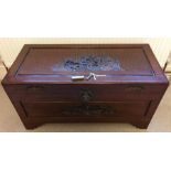Oriental carved wood chest with unusual brass lock. 94cms w, 45cms d, 46cms h.