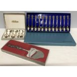 Sterling silver boxed teaspoons, cake knife, with boxed Rolex spoons.