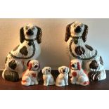 Six Staffordshire dogs, 3 pairs, 24cms largest.
