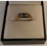 An 18ct diamond and sapphire ring size M, 2.7gms.