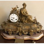 A 19thC gilt decorative mantle clock on base.