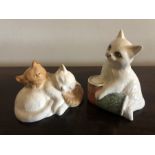 Two Royal Doulton cat figures.