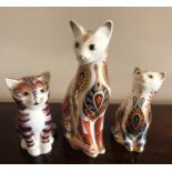 Three Royal Crown Derby cat paperweights. Tallest 13cms h.