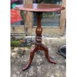 A 19thC wine table on turned stem.