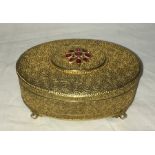 A silver gilt jewellery box inset with rubies and rose cut diamonds standing on pearl feet. 10 x 6.