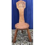 Gnomeman oak spinning chair with carved back panel, height to back 90cms, height to seat 39cms.