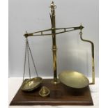 Brass balance scales on a mahogany base, 50 x 28cms, W&T Avery Ltd, Birmingham with weight.