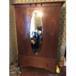 Edwardian inlaid mahogany wardrobe with central oval mirror. 200 h x 47 d x 121cms w.