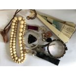 A quantity of costume jewellery etc including miniature compass, hat pins, painted fan, jet pendant,