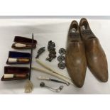 A miscellany to include 3 good quality meerschaum and amber cased cheroot holders, buttons, button