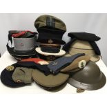 Collection of 19 military hats inc British 2nd WW, French and Russian military, Berets, pith helmet,