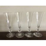Four 19th century glasses. 1 with chip to rim.