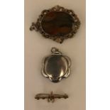 A 9ct gold bar brooch with wishbone, a silver compact and a moss agate mourning brooch. 6cms l.