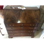 A 19thC mahogany bureau, 4 drawers, brass handles, bracket feet.