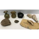 A miscellany to include Roman glass vases, Roman pottery oil lamp, Lava from Mount Vesuvius, a piece