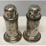 Pair of silver pepper pots, William Hutton and Sons Ltd. Birmingham 1908, approx 72.6gms. 7cms h.