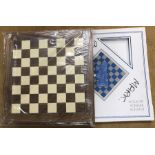 Wooden chess board, unused and boxed.