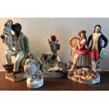 Four Staffordshire figures including Uncle Tom.