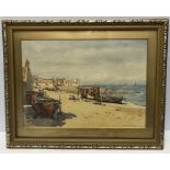Robert W. Allan framed watercolour coastal scene with beached fishing boats. 25cms x 34cms.