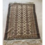 Brown patterned rug. 166 x 106cms.