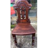 A pair of 19thC hall chairs.