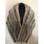 Saga mink grey stole with pockets. Perfect condition.
