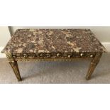 Carved gilt table with puddingstone marble top. 85 l x 44 w x 42cms h.