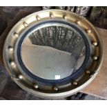 A 19thC round gilt framed convex mirror.